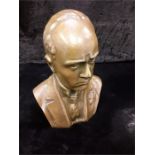 A Mussolini metal bust.