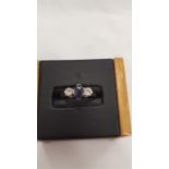 An 18 carat gold diamond and sapphire ring, size M.