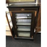 A black ebonised Louis design display cabinet fitted single door and gilt metal mounts key in