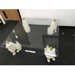 A modern glass top coffee table fitted on the corners with for Kylinsr dogs or Dogs of fo brass