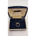 An 18 carat gold diamond pendant on 9 carat white gold chain.