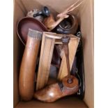 A box containing Treen items printers block, book rack, shoe last, mask, etc.