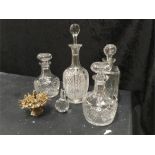 Five glass Decanters and cocktail stick sword stand .