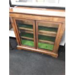 A Victorian walnut and satinwood inlaid pier cabinet fitted two doors and gilt mounts.