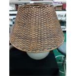 A pair of Modern Indian wicker shaded lamps.