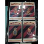 Five albums containing Military, coloured postcards, Crests and Badges of the armed forces etc.