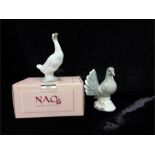 A Nao duck in box with a china dove.