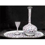 A Iranian enamelled metal tray hand painted floral decoration a vase and napkin ring to match.