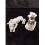 Resin dog in silver colour with a silver hallmark filled study of a dog.