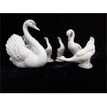 A Lladro Swan ref 5231 boxed with two small Lladro swans and two Nao.