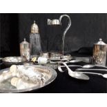 A Victorian collapsible wine bottle holder with silver and plated items.