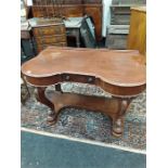 A carved wooden dressing table.