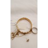 Gold items to include a rolled gold bangle.