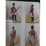 A quantity of red albums containing military postcards of different uniforms, regimental booklets,