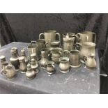 A box of pewter. including tapit, casters, mugs, muffiners etc.