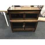 An oak minty 2 section double door bookcase.