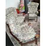 A three piece cottage lounge suite in floral printed tapestry.