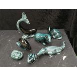 A collection of seven green Poole Pottery animals. Two dolphins, two badgers, one crocodile, one