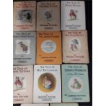 A small quantity of Beatrix Potter books with dust covers.