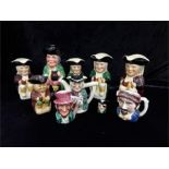 A quantity of Staffordshire Toby jugs with others.