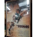 Goonies poster in frame.
