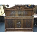 A late 19th century French walnut double bed frame with carved decorative details.