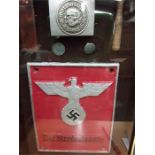 A framed Nazi reproduction plate with original buckle.