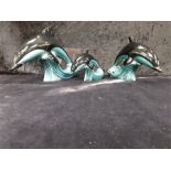 Three Poole Pottery blue glazed Dolphins.