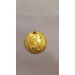 A 1795 22 carat gold Guinea.