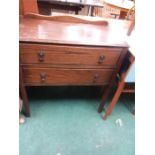 An oak chest of two drawers.