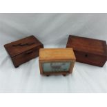 Two small wooden boxes together with a scorpion in small display case.