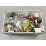 A box of costume earrings and other jewellery.
