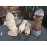 A gnome statue, watering can and two buoys, tin trunk etc.