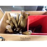 A box of hand tools to include panel beaters hammers and lasts.