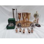 Various items a gold coloured metal tray and six goblet, a paperweight, an onyx clock bottle