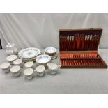 A Colclough tea set along with a box of cutlery.