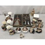 A collection of royal memorabilia including two wall plaques and numerous Royal Doulton toby jugs.