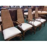 A set of four metal and bamboo conservatory chairs with rattan and rope seat backs.