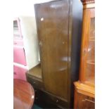 An oak panelled combo wardrobe/chest of three drawers with vanity mirror.