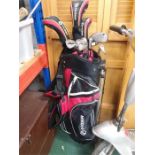 A Fazer golf bag with clubs.