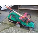 A Qualcast electric mower together with a strimmer.