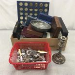 A quantity of cutlery boxes with some loose items.