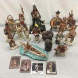 A collection of resin North American indian figures.