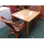 A bistro table with two chairs.