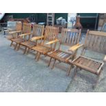 A set of six folding garden armchairs.