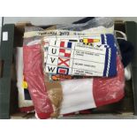 A box of flags and related tea towels.