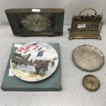 A vintage clock along with various metal items and a Poole Pottery collectors plate.
