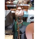 A modern copper effect lantern lampstand.