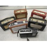 Six vintage radios.