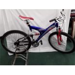 A Claud Butler mountain bike. 24 speed with full suspension and V brakes. Some signs of wear but